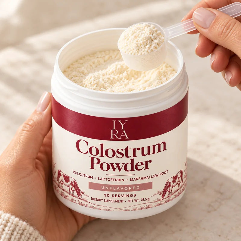 Close-up of the current IYRA white-label colostrum tub, opened with a scoop of powder
